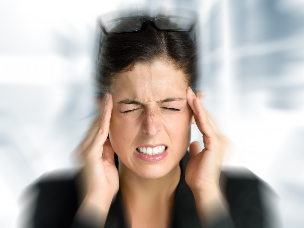 Business woman stress and headache Businesswoman with intense stress and painful headache. Woman in job problems.