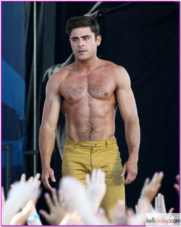 51726753 Actors Zac Efron and Robert De Niro take off their shirts for a "Flex Off" contest for a scene in their new movie "Dirty Grandpa" on April 30, 2015 in Tybee Island, Georgia. The new comedy tells the story of an uptight guy who is tricked into driving his grandfather, a perverted former Army general, to Florida for spring break. FameFlynet, Inc - Beverly Hills, CA, USA - +1 (818) 307-4813