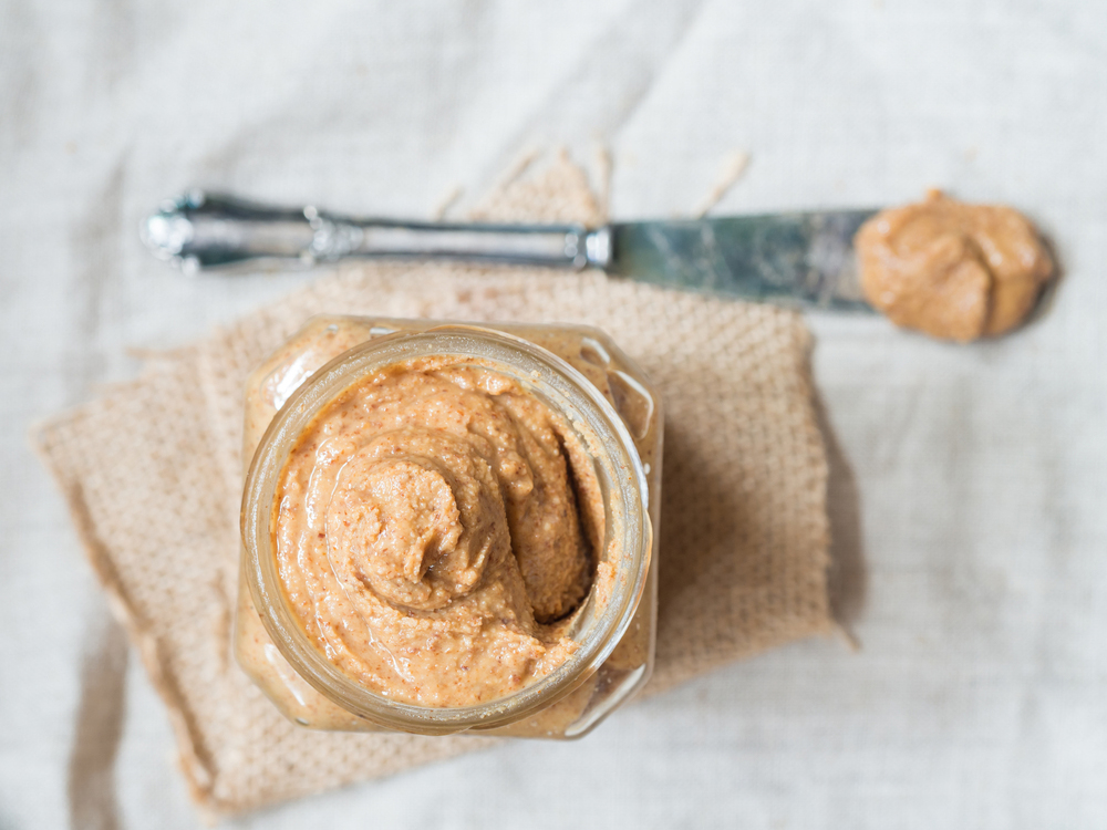 Spot the difference nut butters, jar of almond butter with knife