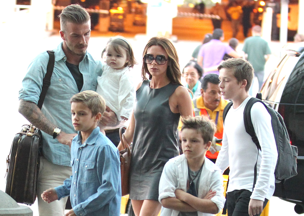 **Exclusive**
David Beckham and Victoria Beckham
arrive at LAX airport with their four children Romeo, Cruz, Harper and Brooklyn to board a flight
Los Angeles, California - 05.07.12
Mandatory Credit: KMA/WENN.com