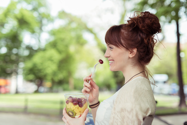 woman_eating_fruit_salad