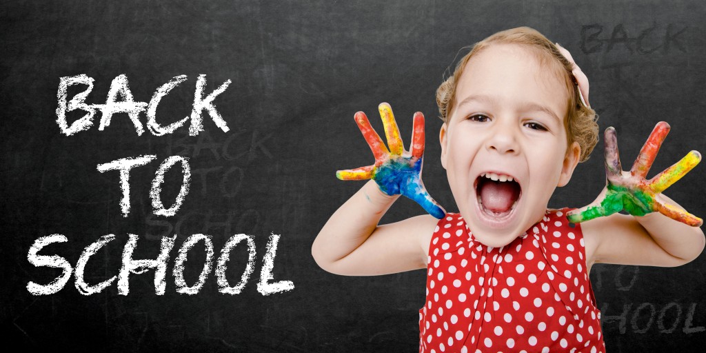 Happy child back to school Positive child with colorful hands by sign back to school