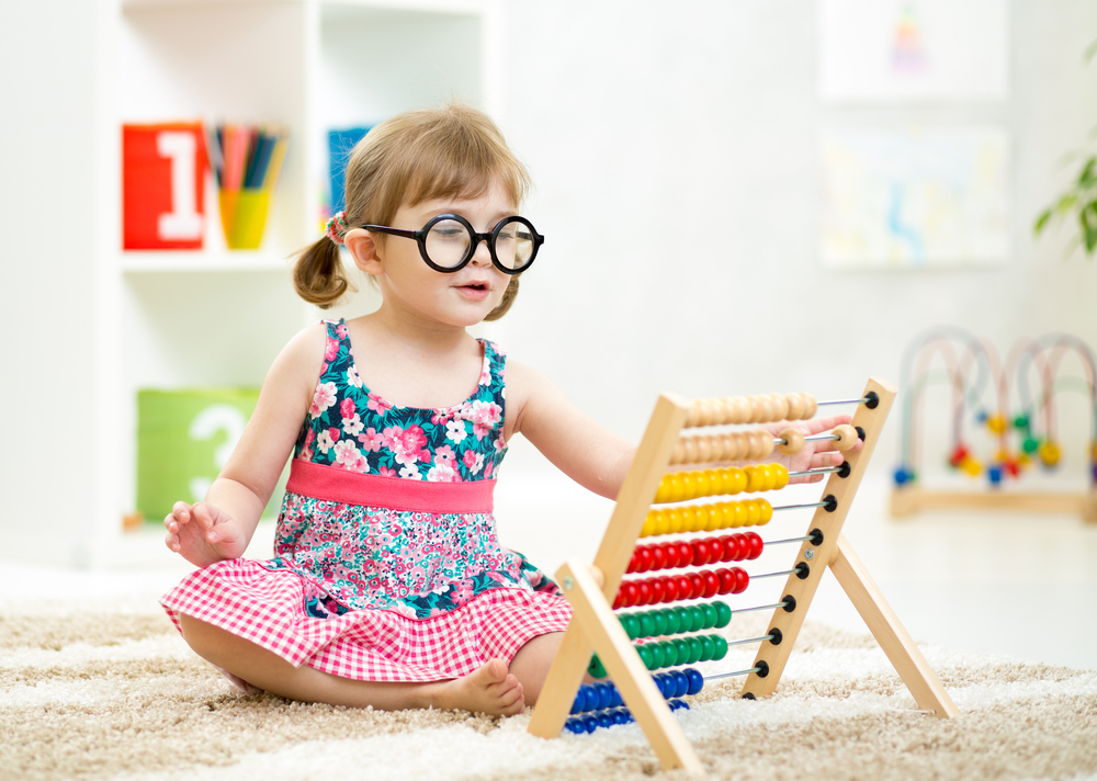 Smart Kid Playing with Educational Toy