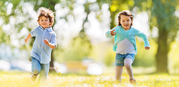 boy-girl-running-park