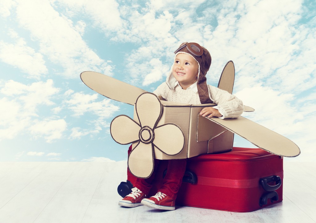 bigstock-Little-Child-Playing-Airplane-85445417
