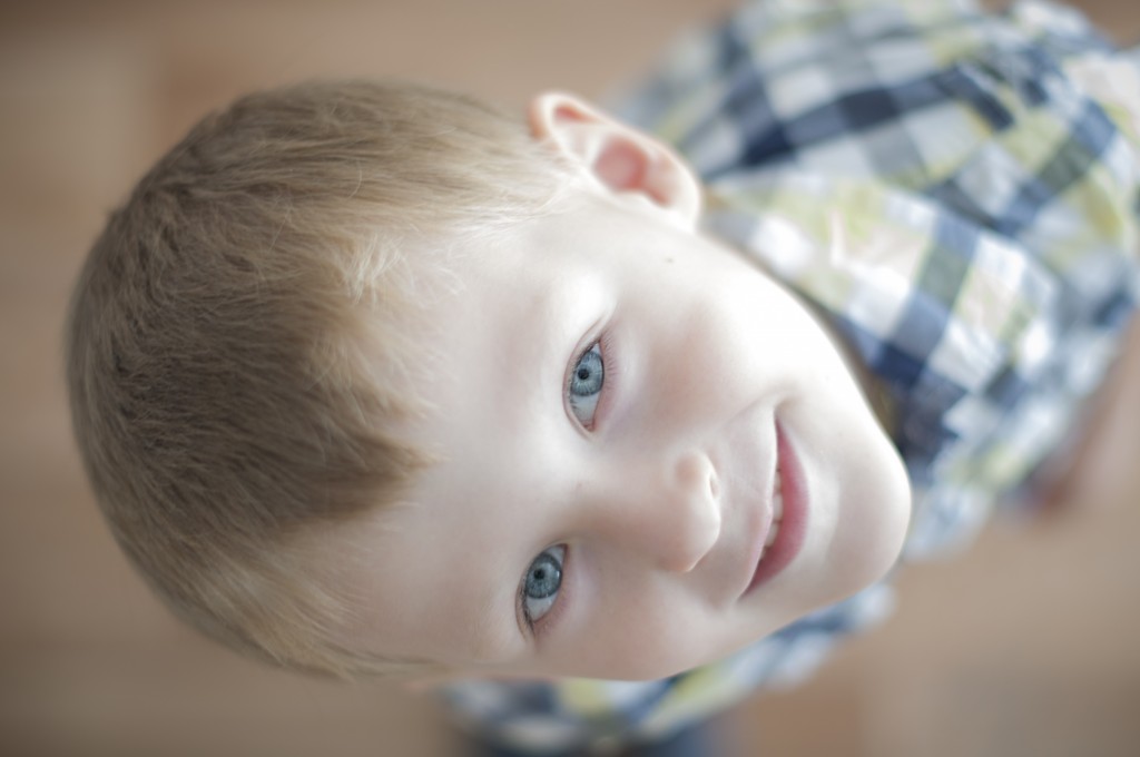 happy cheerful kid is looking at his parent