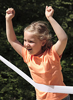 Girl_crossing_finish_line_of_race Girl_crossing_finish_line_of_race