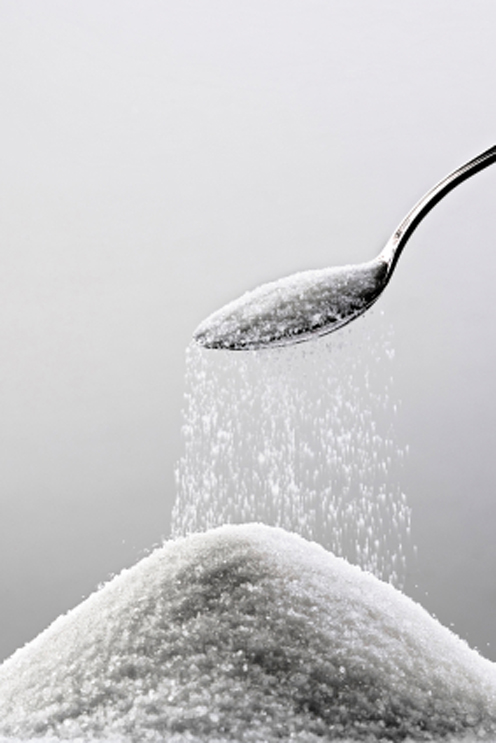 spoon_with_sugar_falling_into_pile