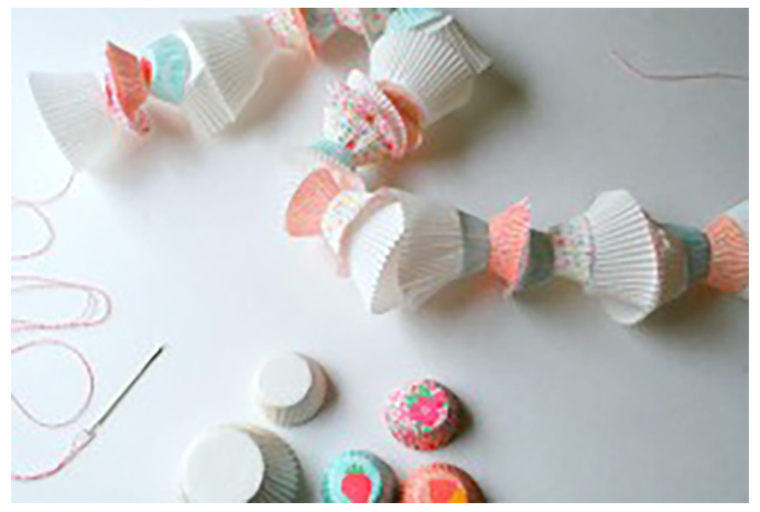 The decor headliner will most certainly be this banner made of cupcake liners. 