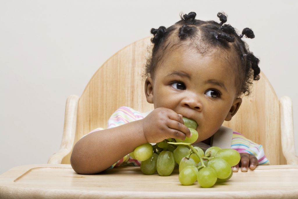 Baby girl eating grapes Baby girl eating grapes