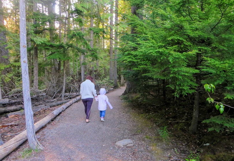 A mother and her young daughter walking through the forests of pacific spirit regional park in Vancouver, British Columbia, Canada. May Long Weekend in Vancouver - SavvyMom