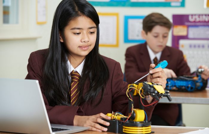 Pupils In Science Lesson Studying Robotics