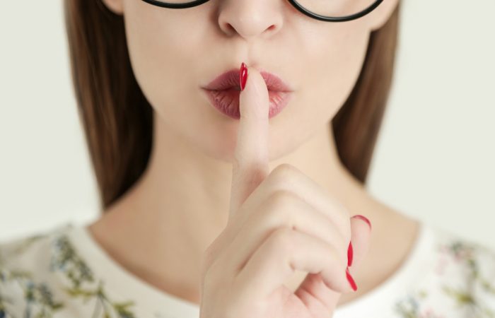 Finger on lips - silent gesture