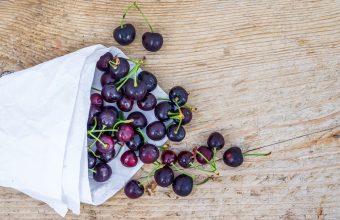 Superfoods we love cherries, whole ripe cherries on wooden board