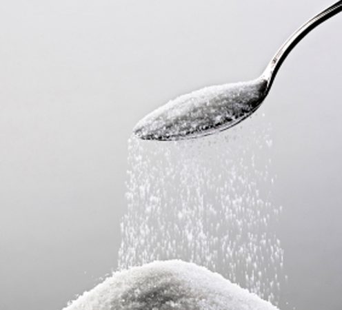 spoon_with_sugar_falling_into_pile