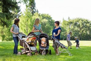 Moms Talking in Park with children