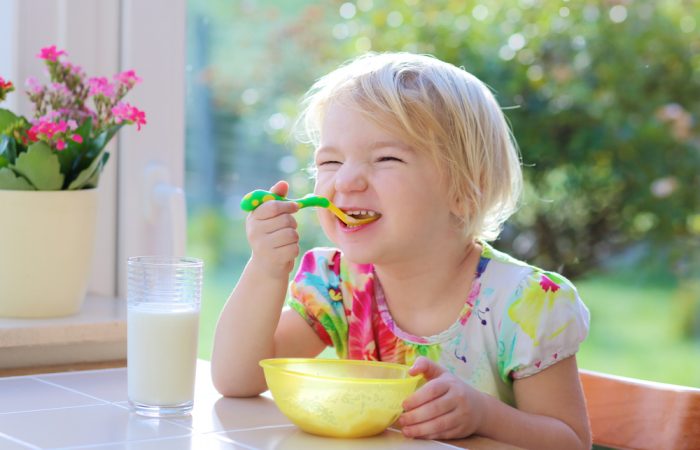Child Enjoying Breakfast