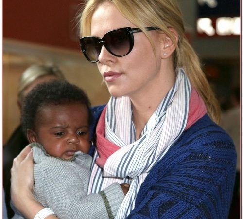 Charlize Theron And Baby Jackson Land In Paris