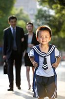 RBCBoy_in_school_uniform_in_front_of_parents