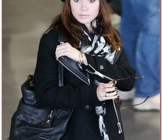 Lily Collins Touches Down In Paris