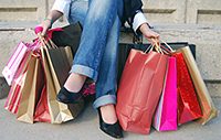 woman_holding_lots_of_shopping_bags