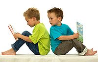 two_boys_reading_books