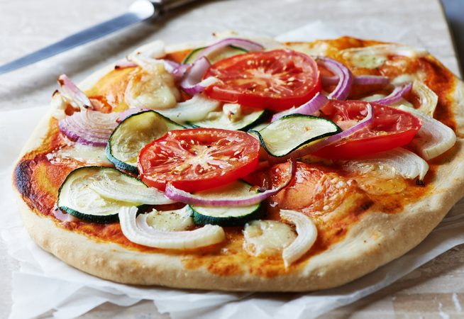 Quick and Easy Vegetarian Pizza with tomato, onion and zucchini