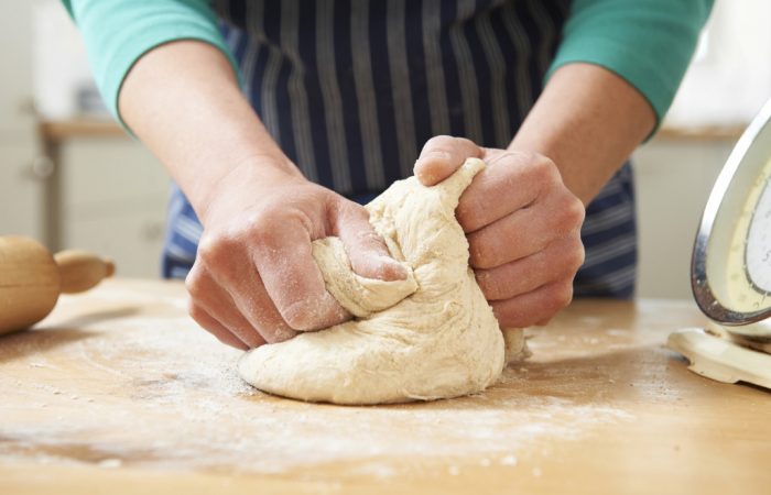 Close Up Of Hands Kneading Dough