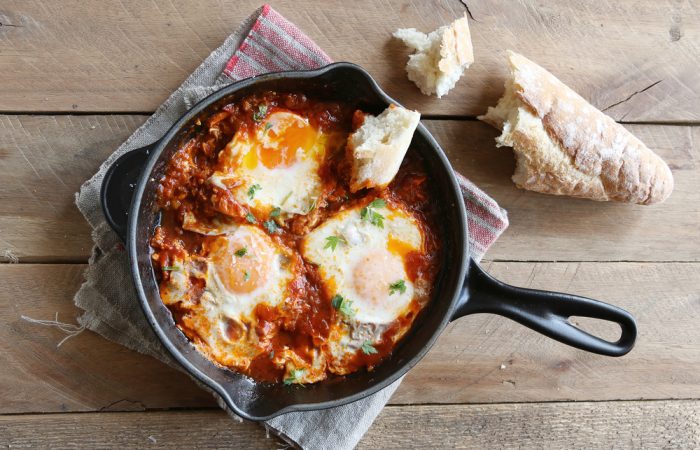 Poached eggs in a spicy tomato sauce, marinara sauce