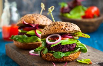 10 Best Vegetarian Burgers, 2 veggie burgers on wood cutting board