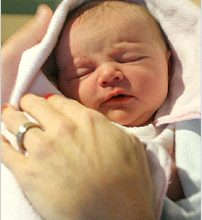 newborn_in_hands_EN