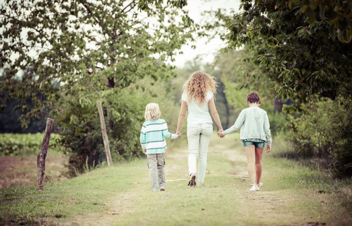 Young-Woman-with-Two-Children-Outside