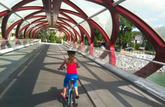 Child-cycling-over-pedestrian-bridge