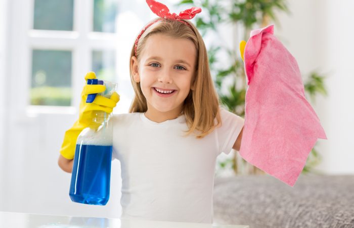 Happy smiling cute girl successful doing housework obligations