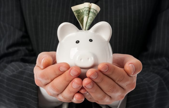 Holding piggy bank
