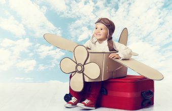 bigstock-Little-Child-Playing-Airplane-85445417
