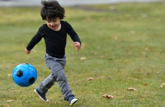 young-boy-chases-ball-612x300