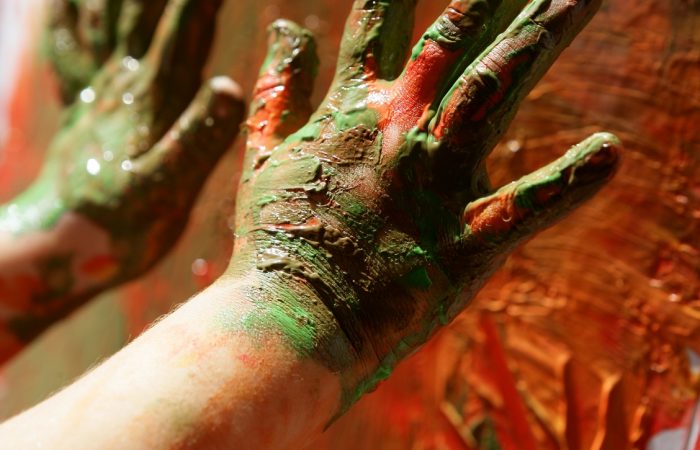 Children artist hands painting colorful