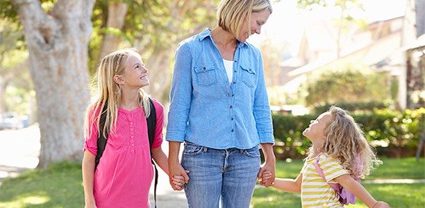mom-walks-daughters-to-school-612x300