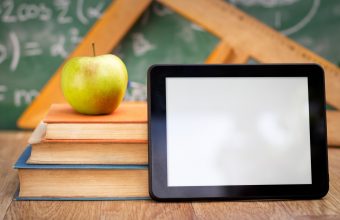 Empty tablet pc with books