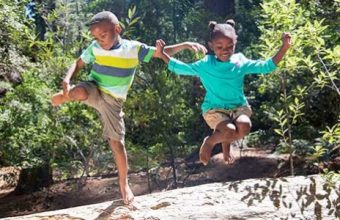 kids-leaping-from-log-612x300