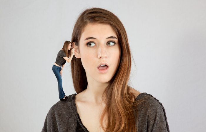 Woman listening to herself