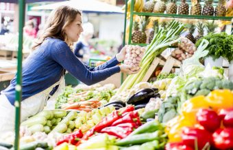 Woman Shopping for Organic Vegetables at Farmers Market