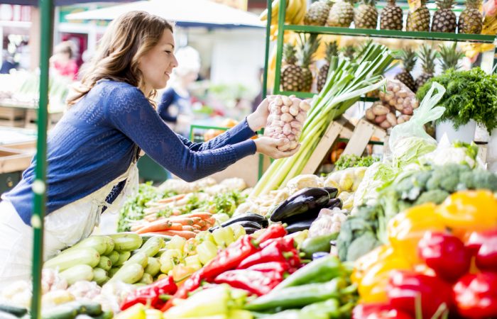 Woman Shopping for Organic Vegetables at Farmers Market