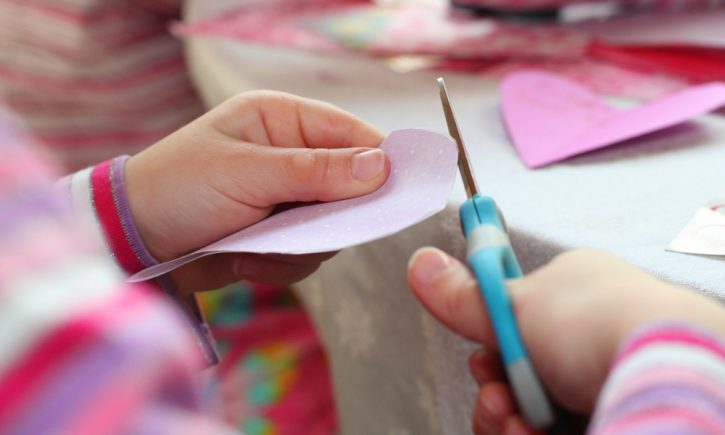 Child Making Valentine Craft