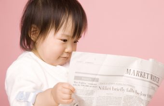 Baby Reading Newspaper