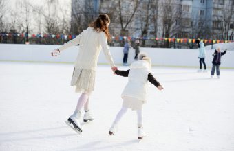 Mother and Daughter Skating Outside