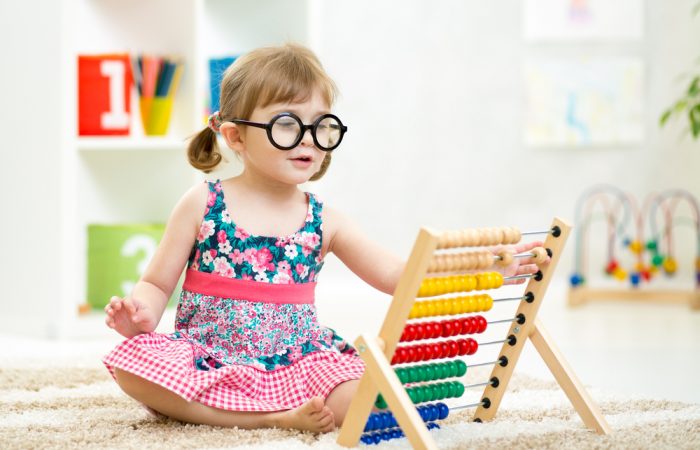 Smart Kid Playing with Educational Toy
