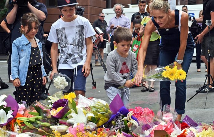 children-lay-flowers-at-martin-place-data