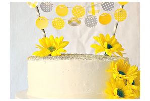 Baby Shower Cake With Paper Banner and Fresh Flowers